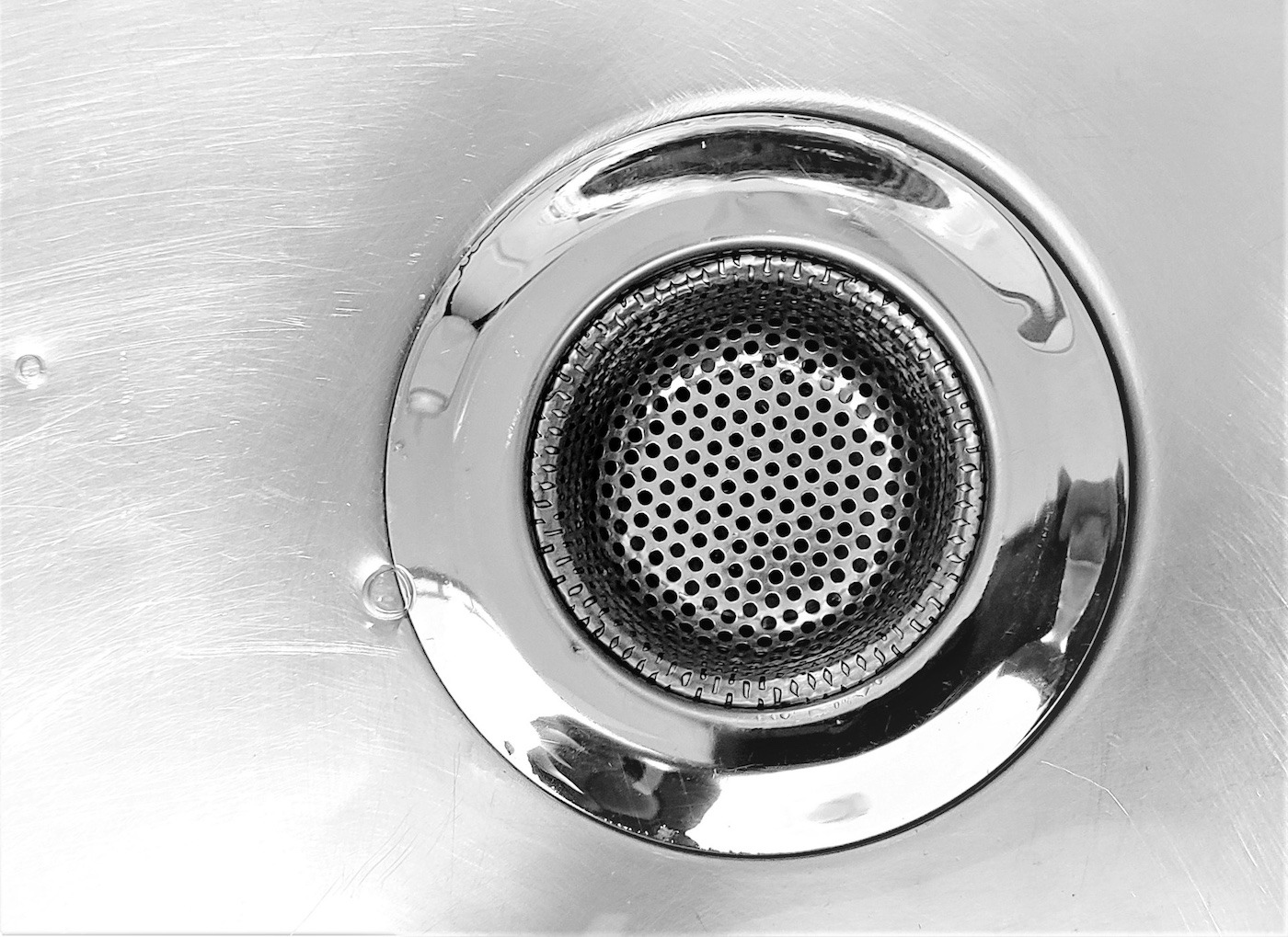 Sink plug-hole - Photo by Daniel Dan on Unsplash