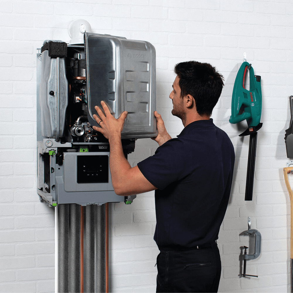 Gas engineer removing worcester bosch boiler case